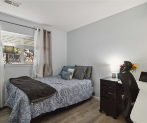 Secondary bedroom with luxury vinyl flooring
