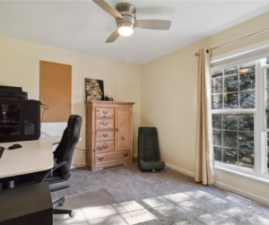 Third Bedroom off of the top level of the trilevel with a backyard view!