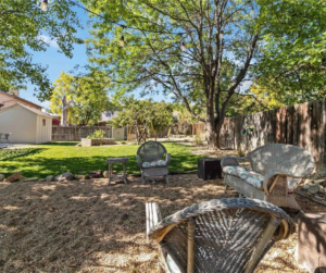 Sitting area with gravel and mature trees providing all the shade needed to relax.